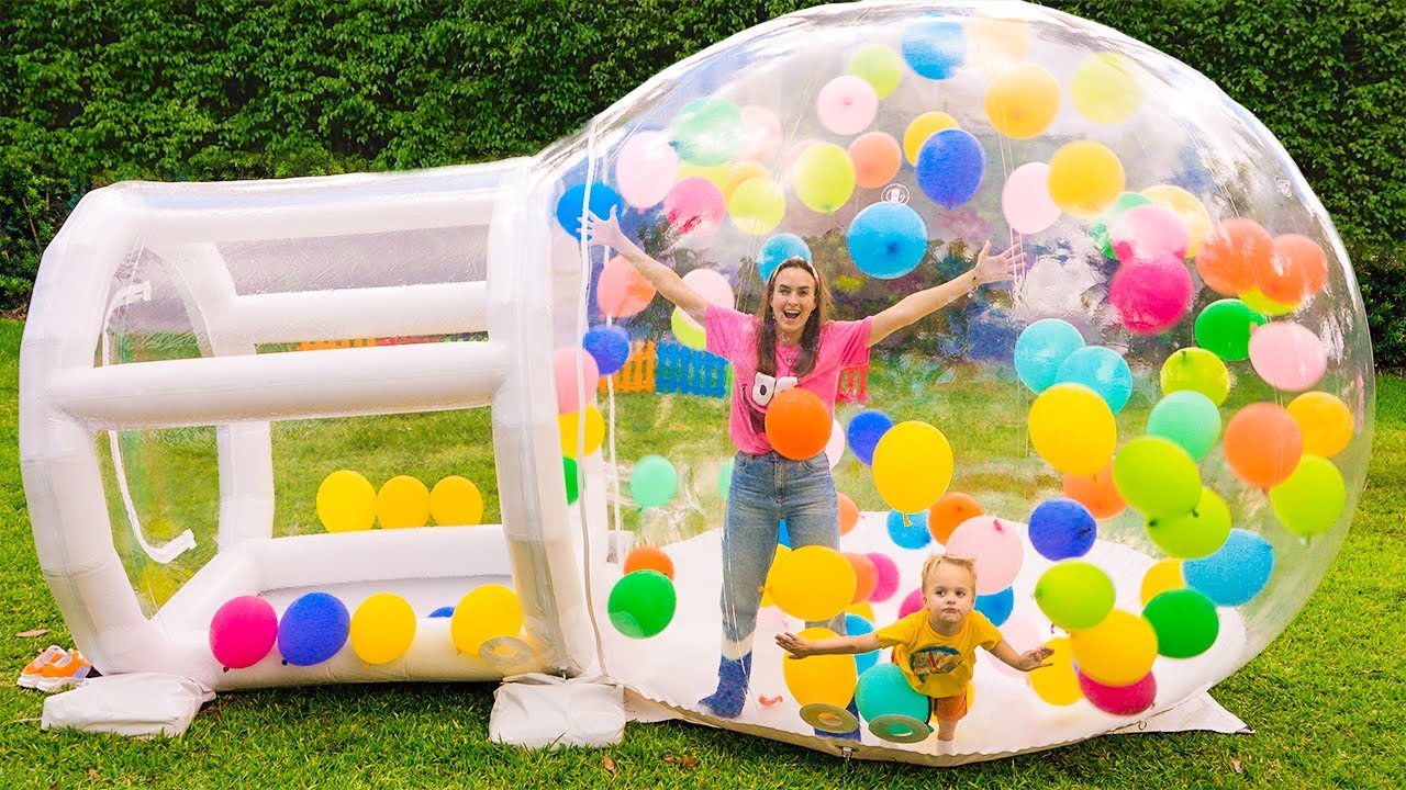 Vlad and Niki play with inflatable toys