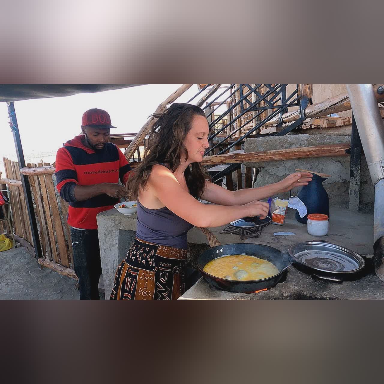Canadian and African Husband Making Breakfast for Family in the Village