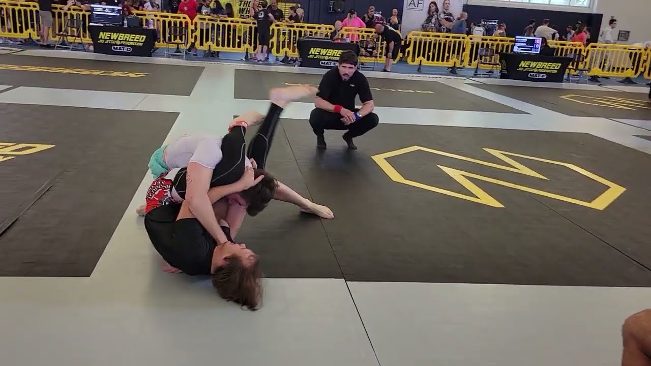 Combatants Change Position About A Hundred Times In No Gi BJJ Match BeforeTriangle Choke.