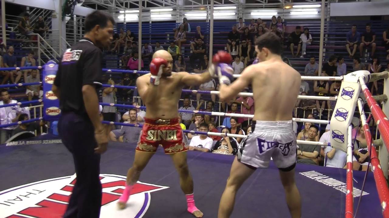 Dennis (Red corner- Sinbi Mauy Thai) fights at Bangla Boxing Stadium- 15.7.2016