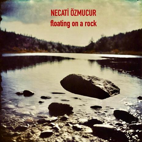 floating on a rock cover art