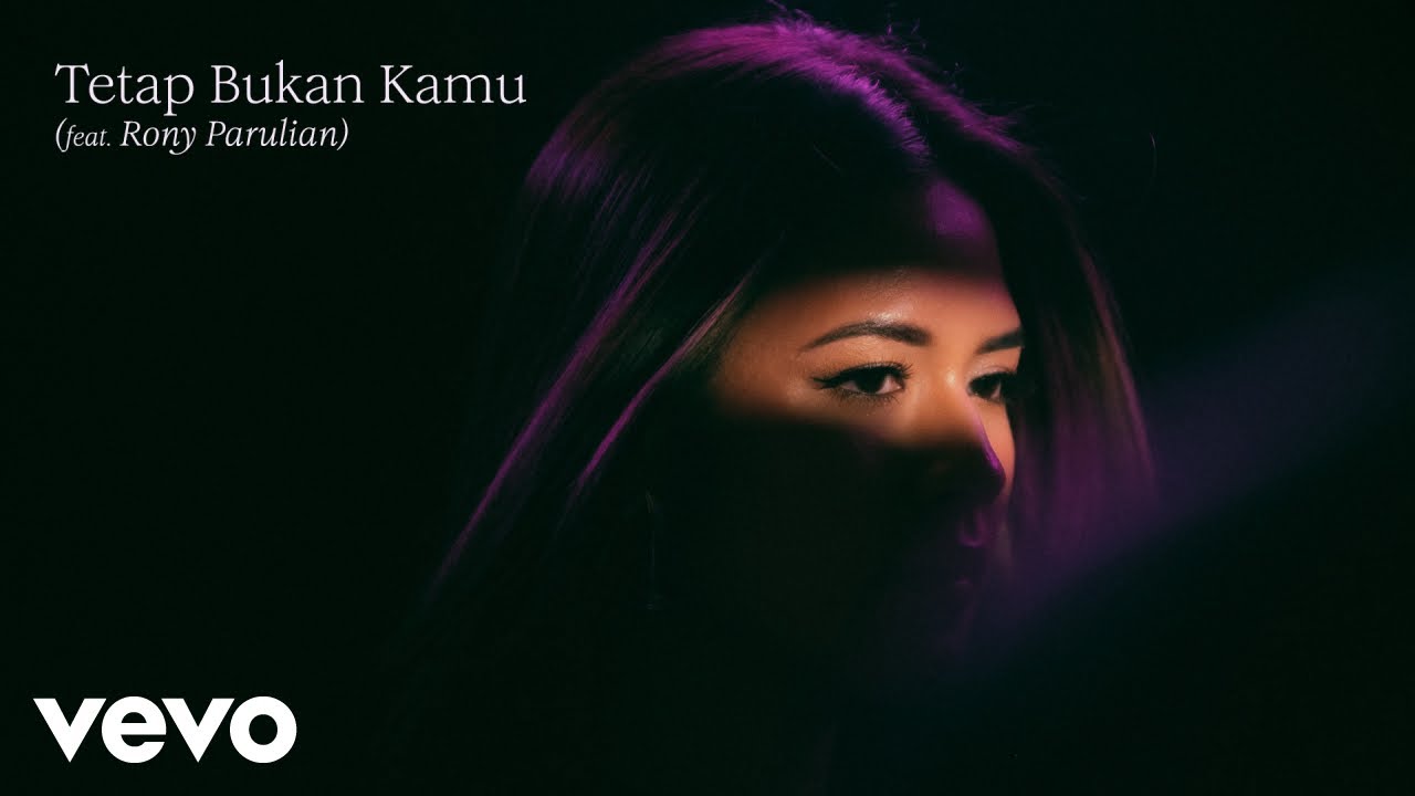 Raisa, Rony Parulian - Tetap Bukan Kamu (Official Lyric Video) cover art