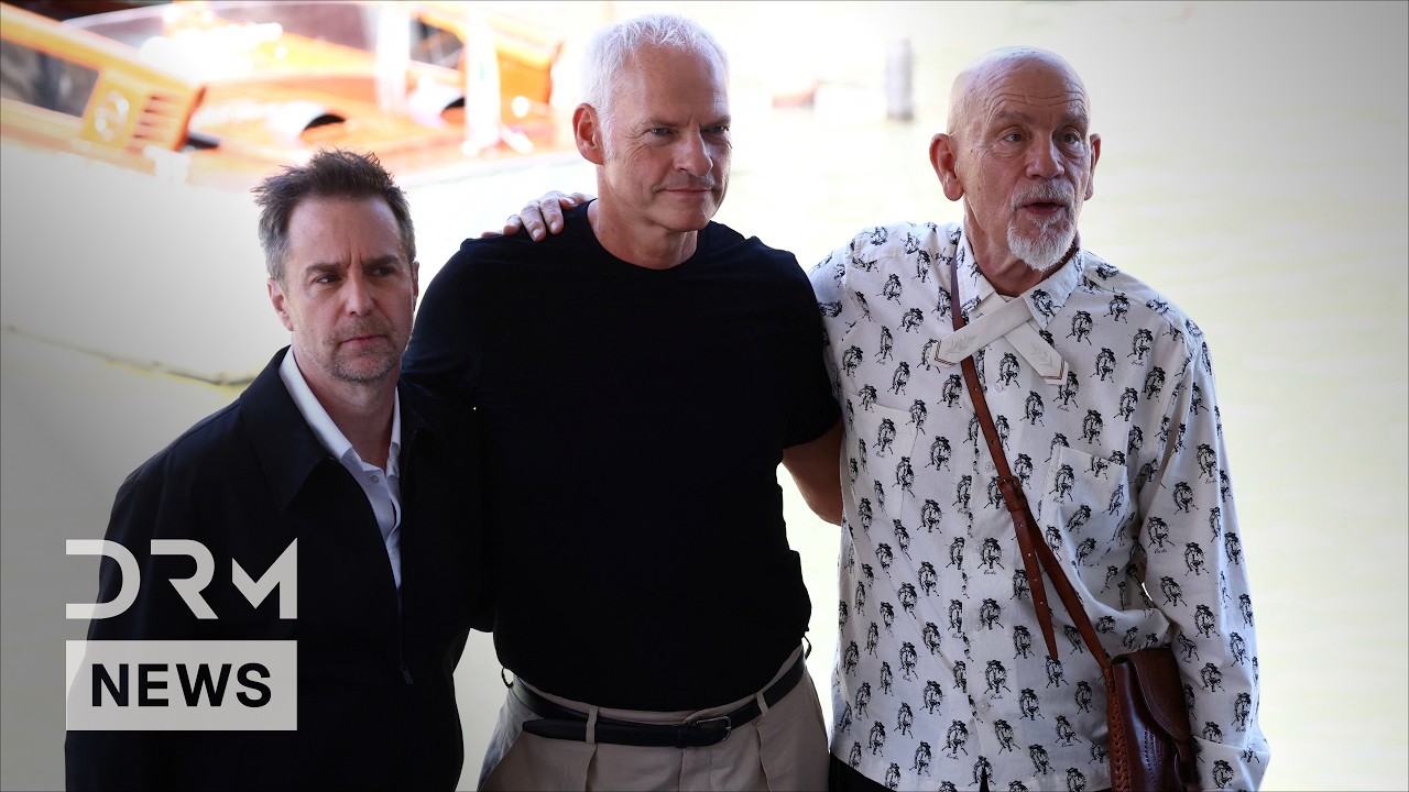 ‘Wild Horse Nine's John Malkovich, Sam Rockwell Join Martin McDonagh at Venice Film Festival | AA1G cover art