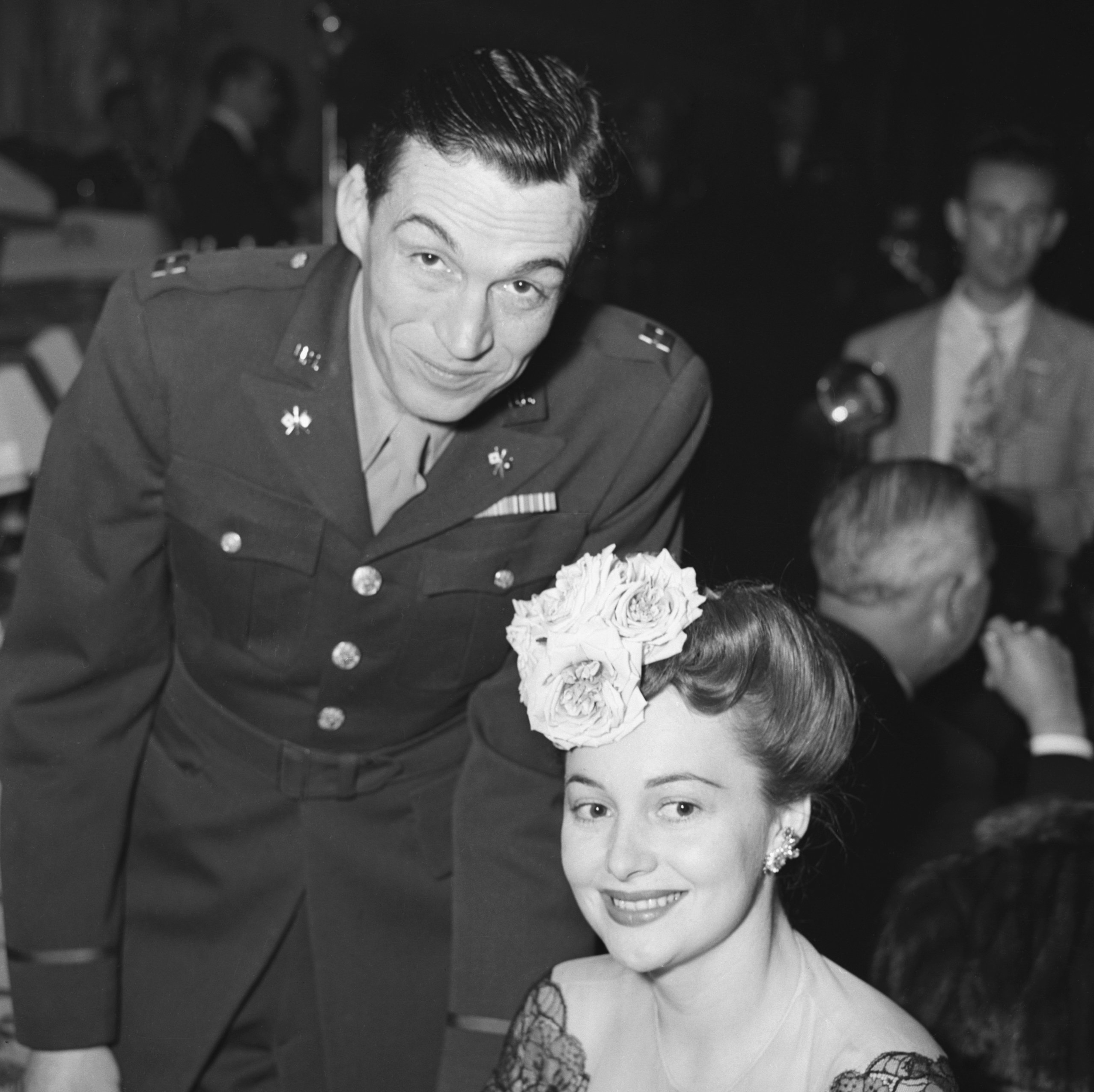 Flashback: John Huston and Olivia de Havilland cover art